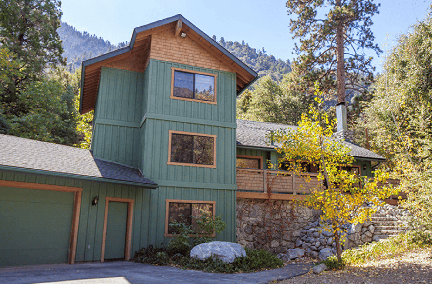 Forest home engle house. Green house with three stories in the mountains